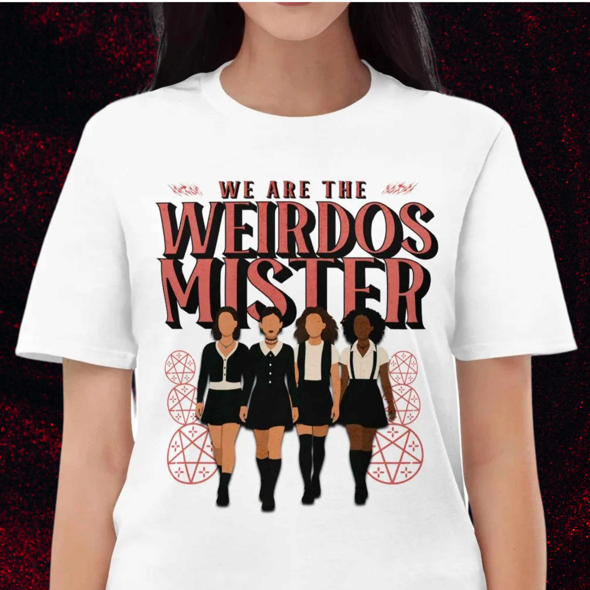 White T-shirt featuring four illustrated gothic girls walking together beneath bold text that reads “We Are the Weirdos Mister,” inspired by the cult classic film The Craft.